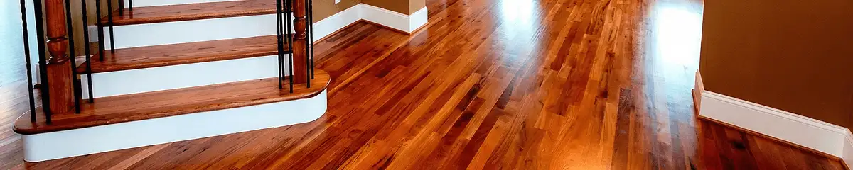 Base floor of a staircase with professionally restored wood flooring in Erie PA