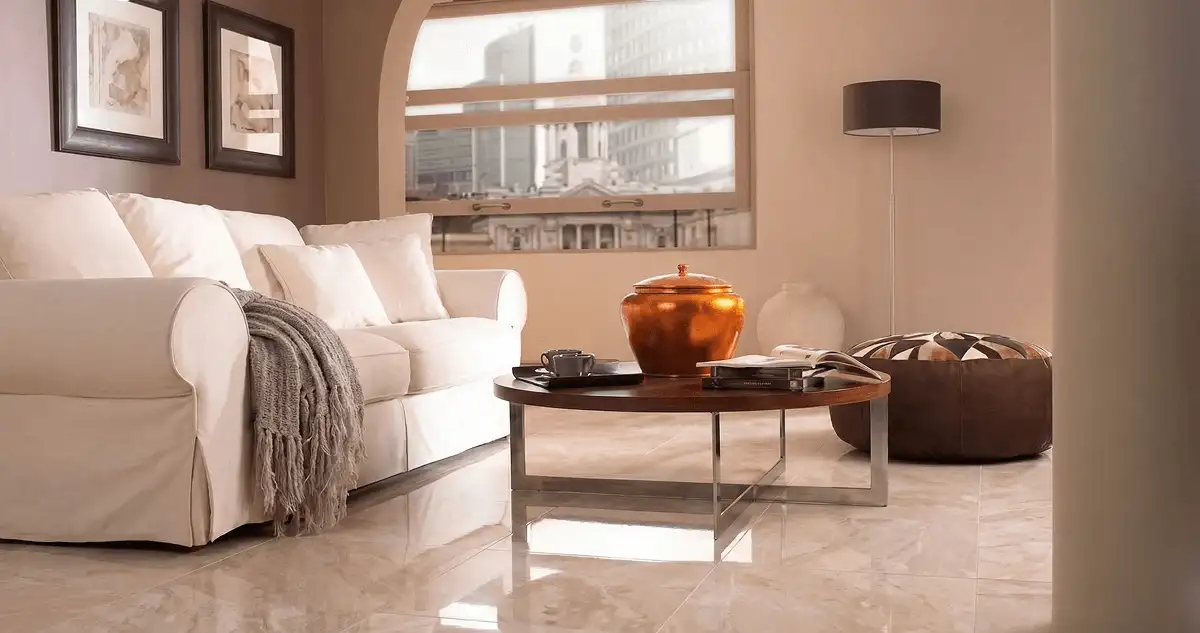 Modern living room with professionally installed marble flooring, a beige sofa, coffee table in Erie, PA