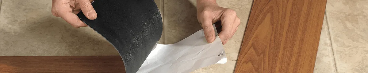 A professional installing vinyl flooring in Erie, PA