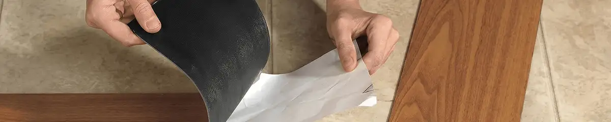 A professional installing vinyl flooring in Erie, PA